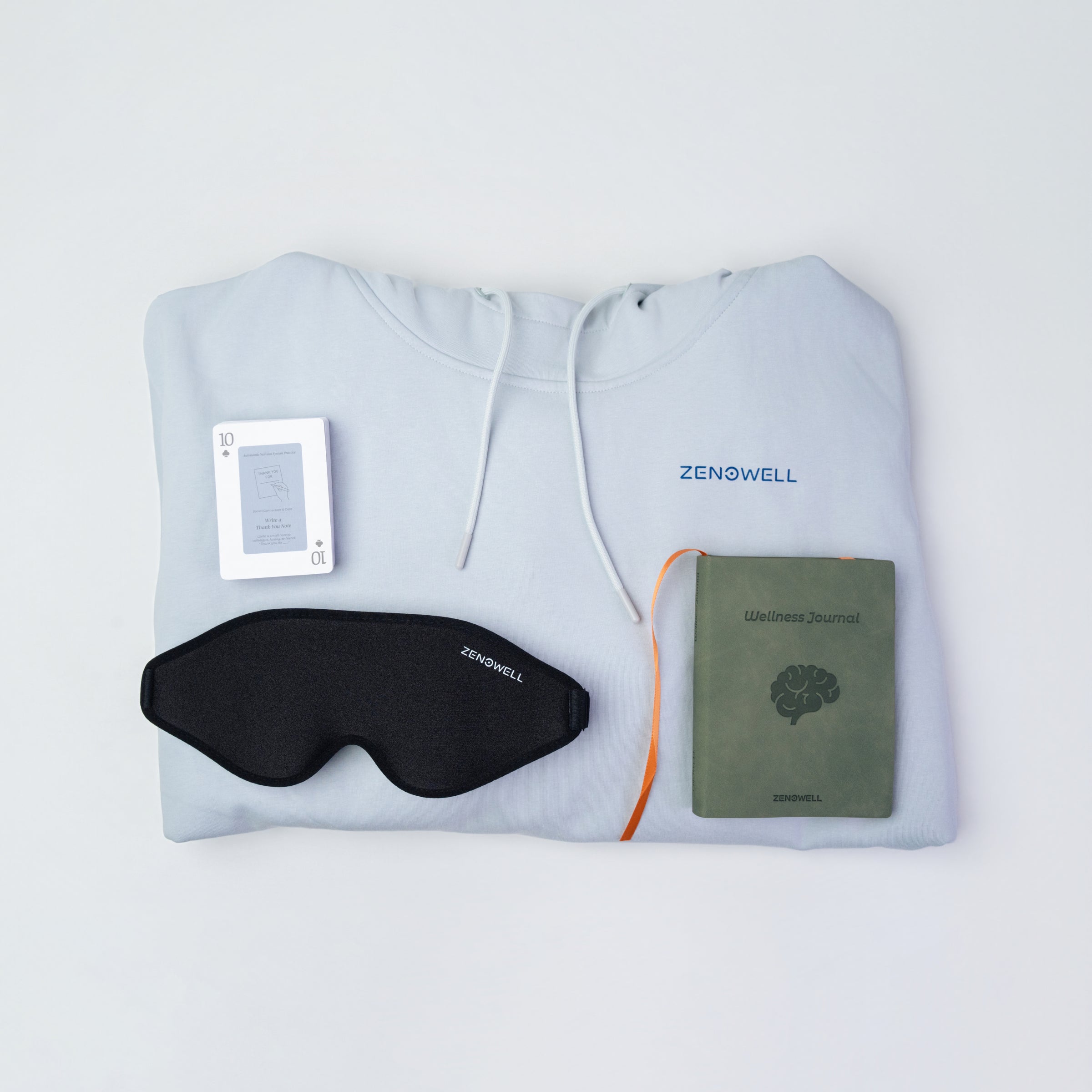 A hoodie, Eye Mask, Wellness Journal, Relaxation Cards, all designed to support relaxation, stress relief, and well-being through transcutaneous auricular vagus nerve stimulation (taVNS).