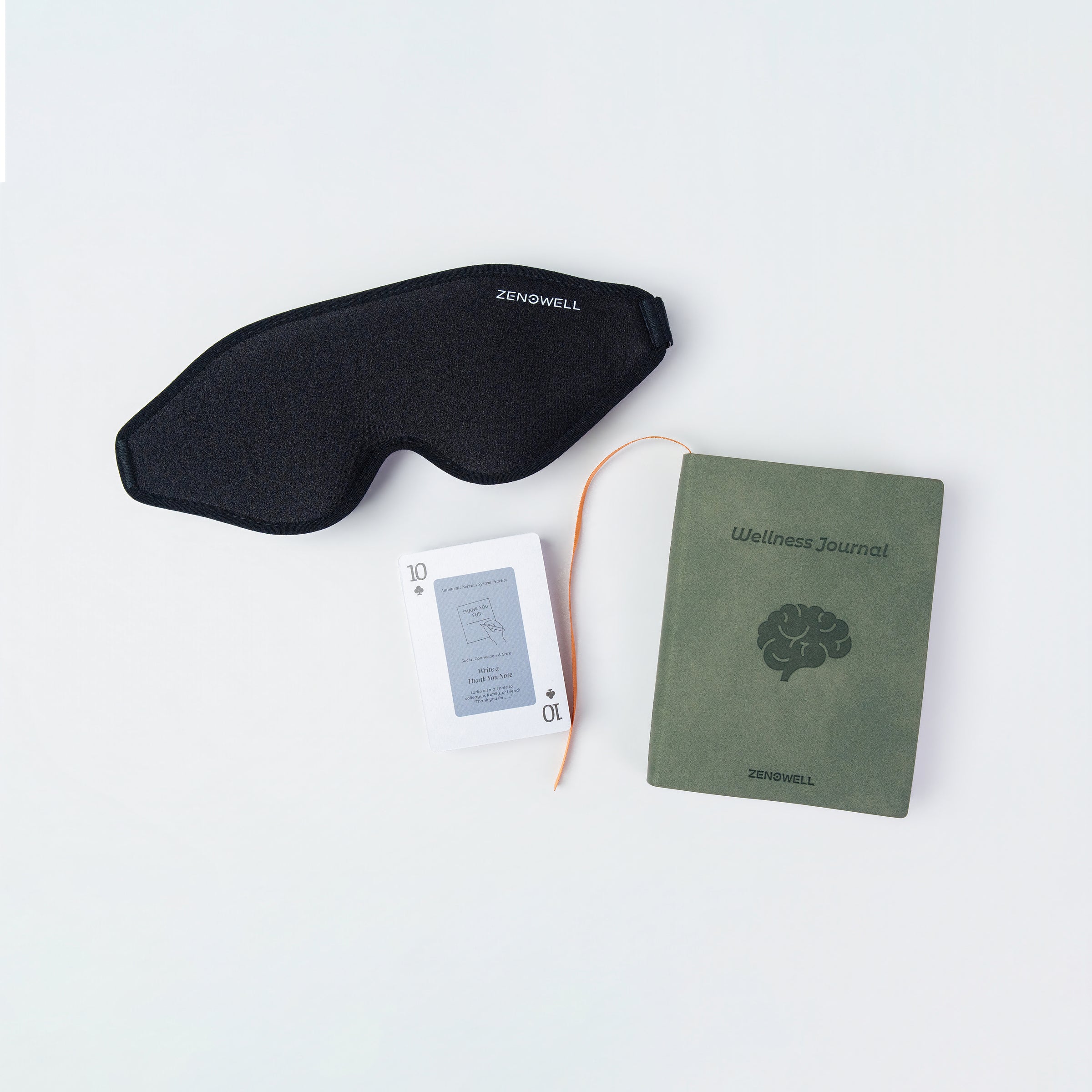 ZenoWell eye mask, relaxation cards and wellness journal, designed to support relaxation and mindfulness for improved well-being.